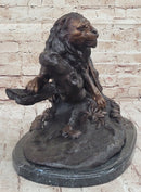 Lion Resting on a Branch - Bronze Sculpture by J. Moigniez