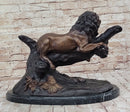 Lion Resting on a Branch - Bronze Sculpture by J. Moigniez
