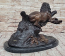Lion Resting on a Branch - Bronze Sculpture by J. Moigniez