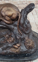 Lion Resting on a Branch - Bronze Sculpture by J. Moigniez