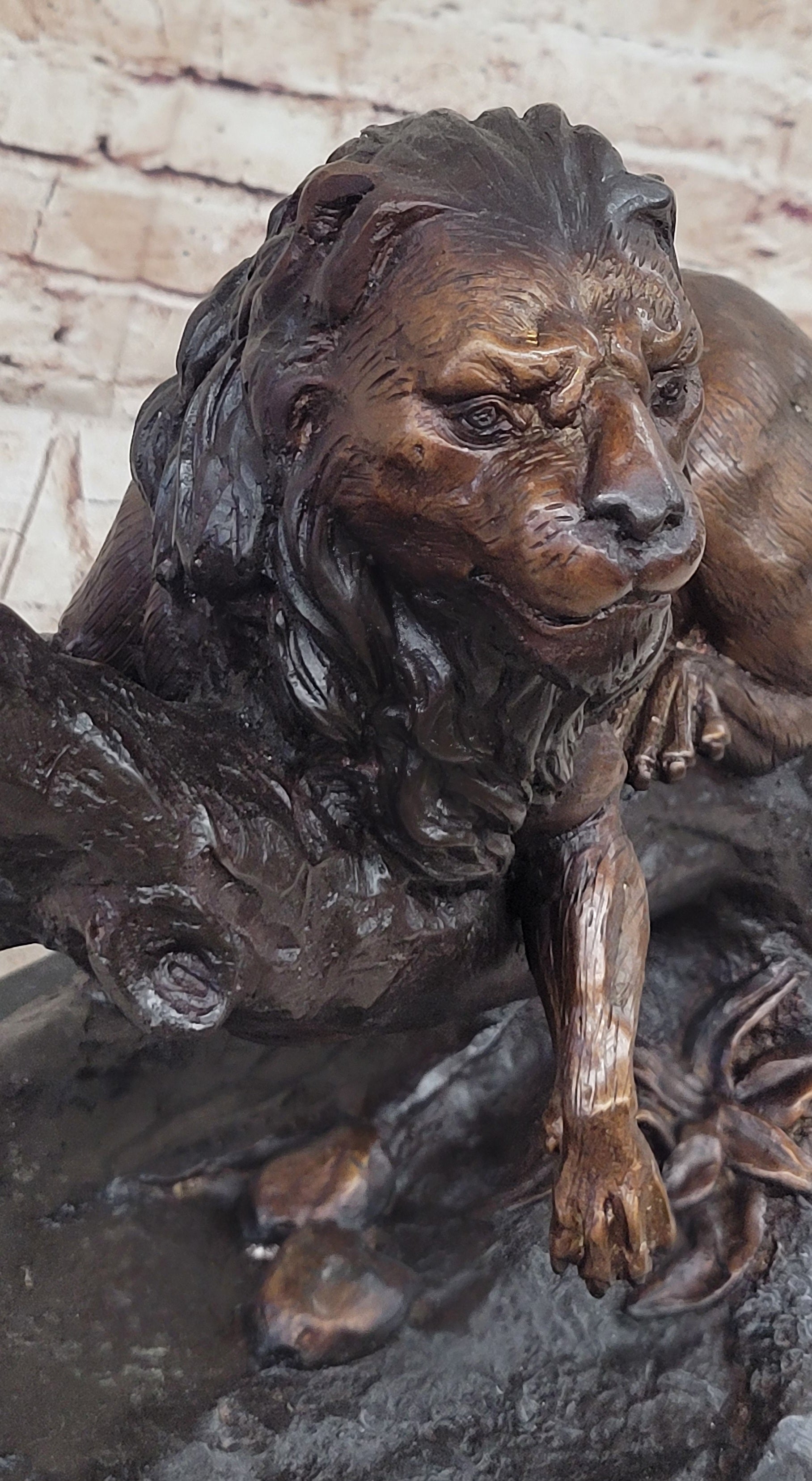 Lion Resting on a Branch - Bronze Sculpture by J. Moigniez