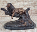 Lion Resting on a Branch - Bronze Sculpture by J. Moigniez