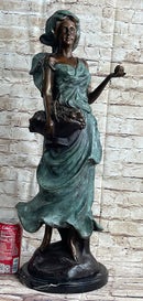 Signed Bronze Sculpture of Young Woman with Basket of Fruits
