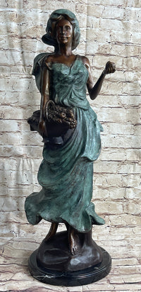 Signed Bronze Sculpture of Young Woman with Basket of Fruits