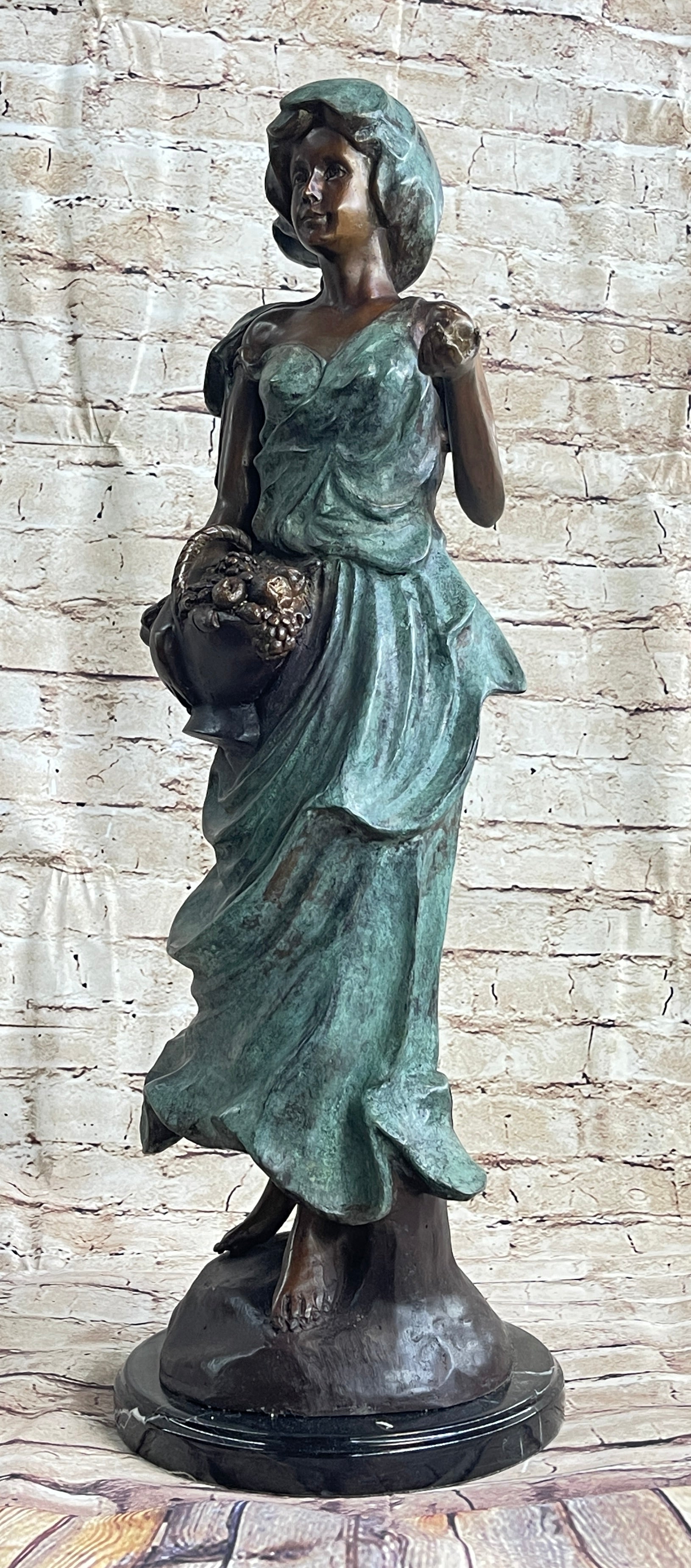 Signed Bronze Sculpture of Young Woman with Basket of Fruits