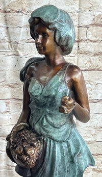 Signed Bronze Sculpture of Young Woman with Basket of Fruits