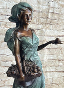 Signed Bronze Sculpture of Young Woman with Basket of Fruits