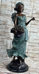 Signed Bronze Sculpture of Young Woman with Basket of Fruits
