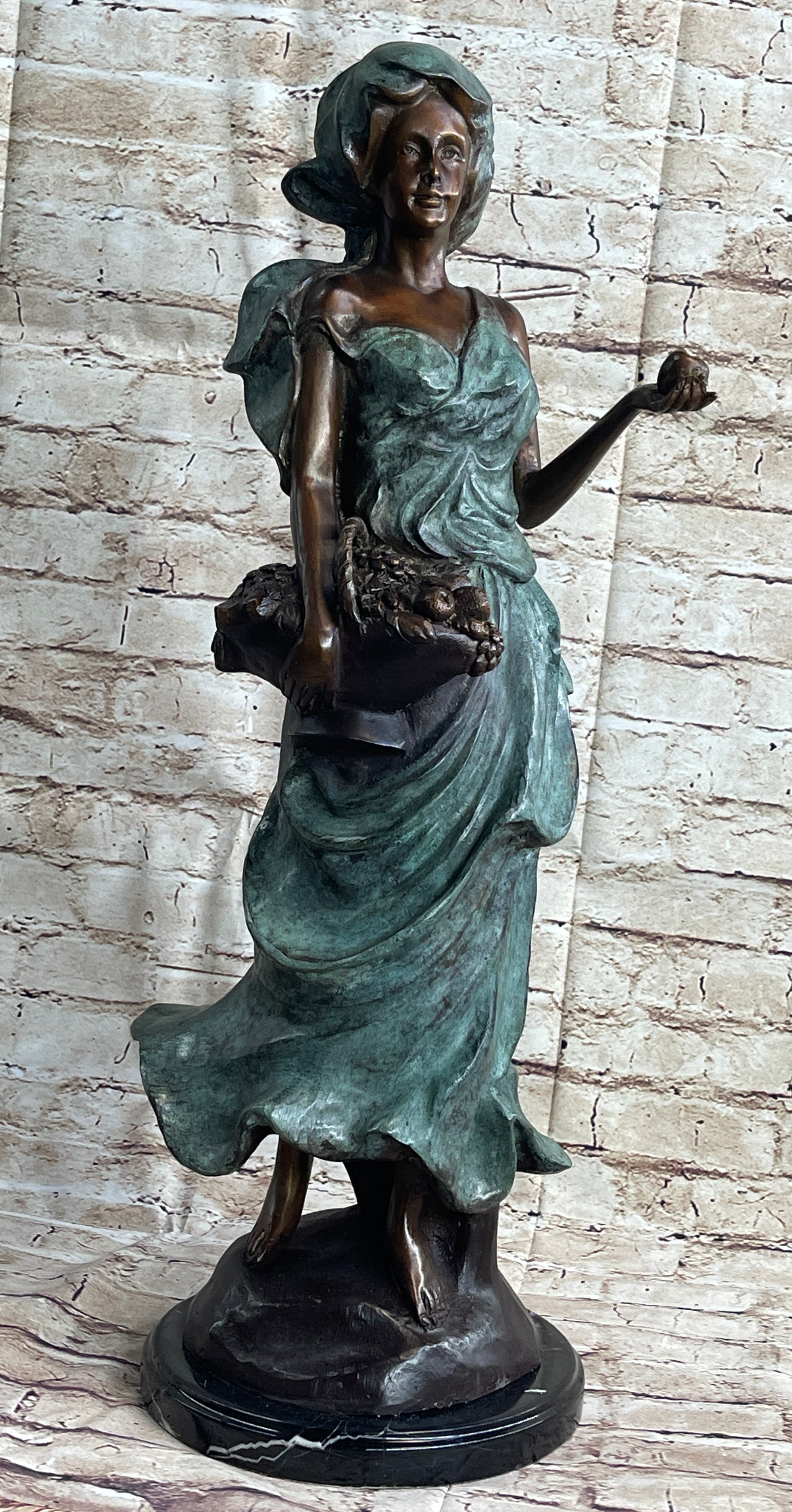 Signed Bronze Sculpture of Young Woman with Basket of Fruits