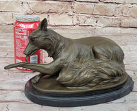 German Shepherd Licking Paw Bronze Sculpture Milo