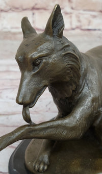 German Shepherd Licking Paw Bronze Sculpture Milo