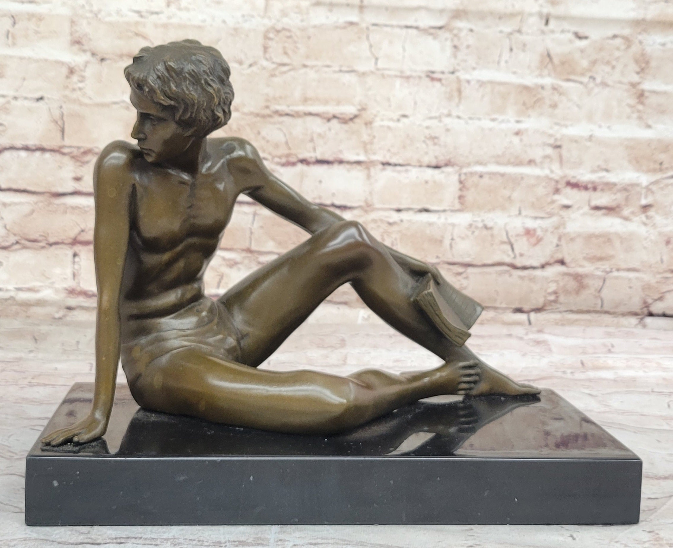 Young Man Reading a Book on the Beach - Bronze by Preiss
