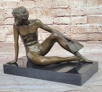 Young Man Reading a Book on the Beach - Bronze by Preiss