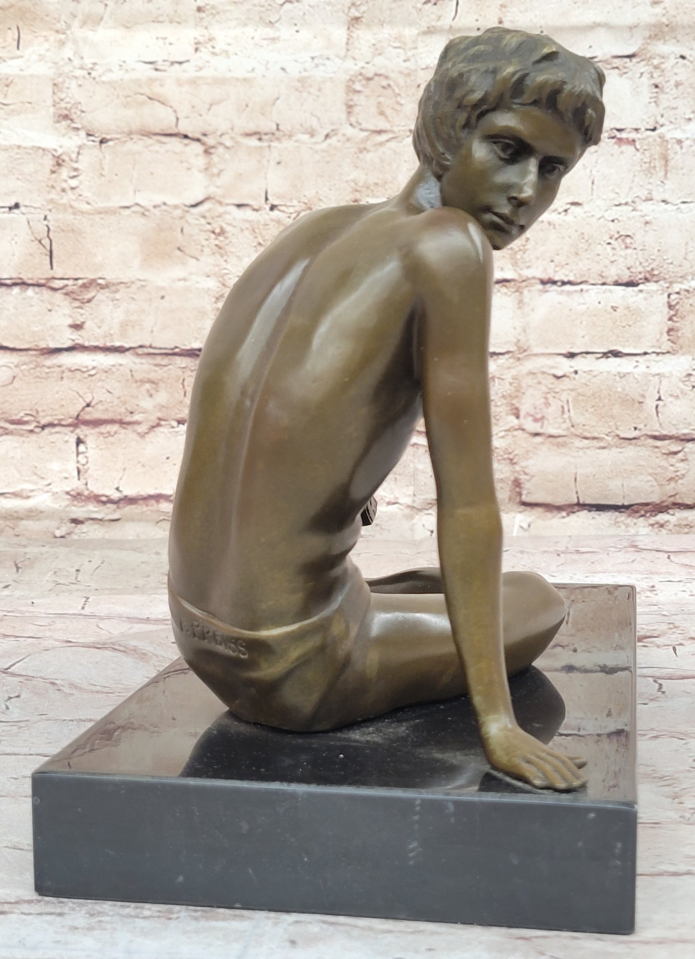 Young Man Reading a Book on the Beach - Bronze by Preiss