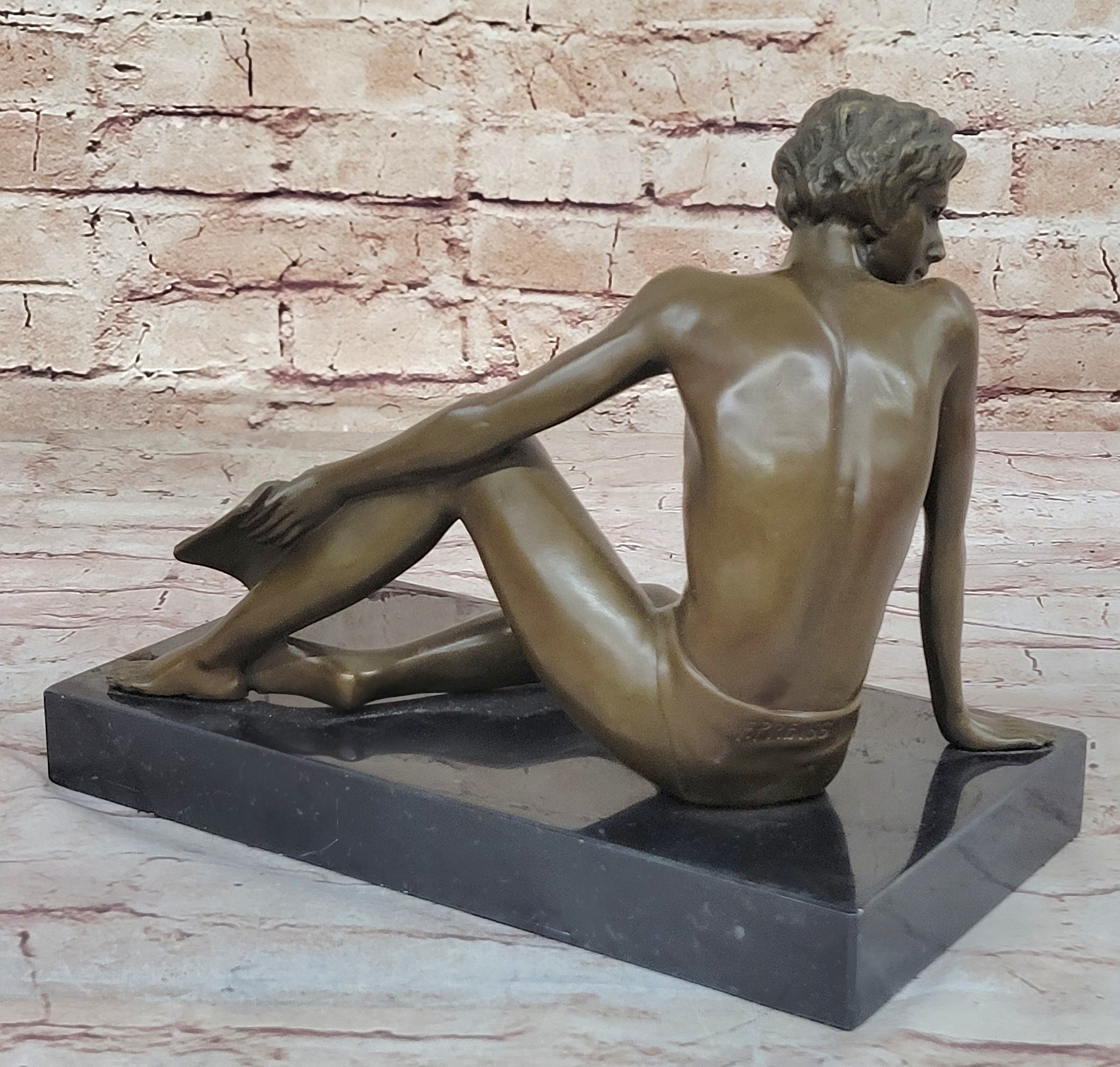 Young Man Reading a Book on the Beach - Bronze by Preiss