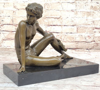 Young Man Reading a Book on the Beach - Bronze by Preiss
