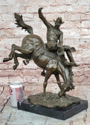 Bronze Sculpture Depicting a Cowboy on a Bucking Horse by Remington Art