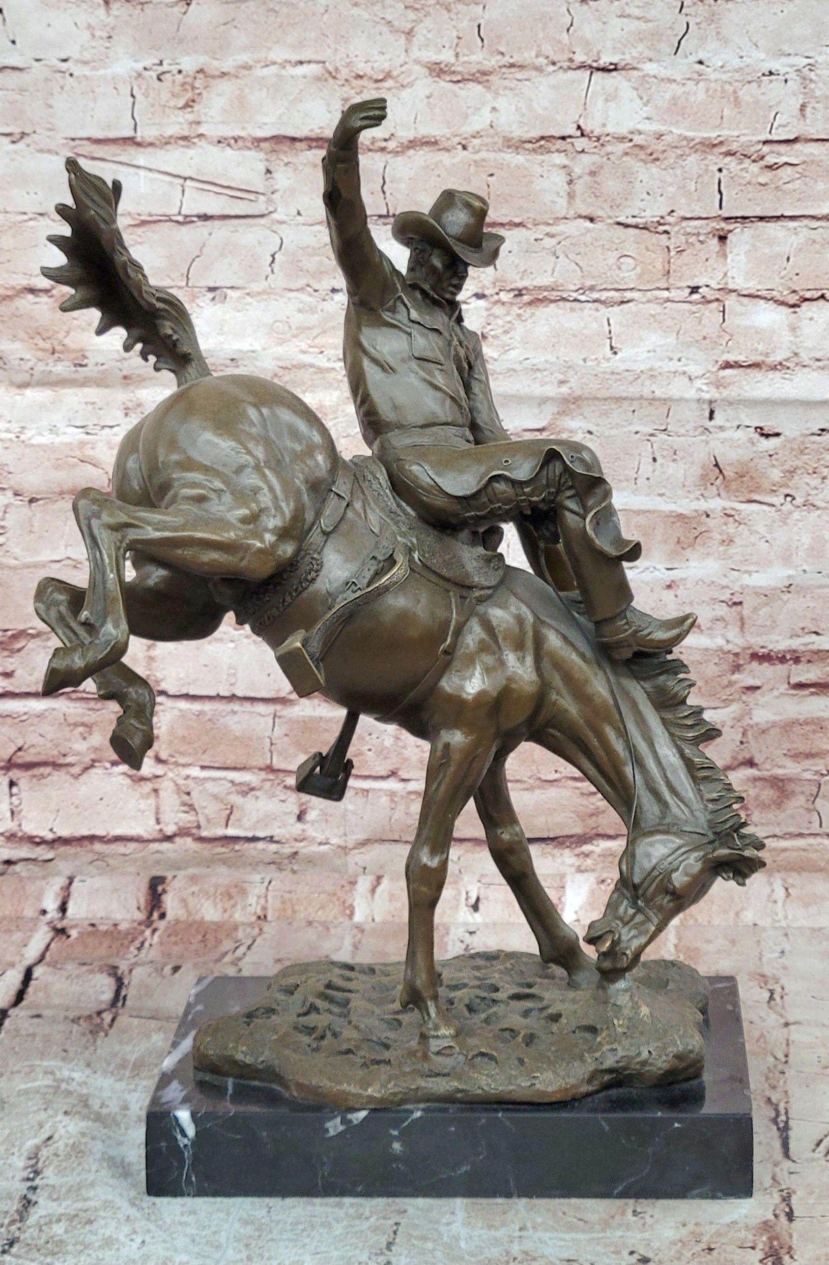 Bronze Sculpture Depicting a Cowboy on a Bucking Horse by Remington Art