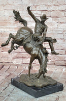 Bronze Sculpture Depicting a Cowboy on a Bucking Horse by Remington Art