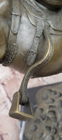 Bronze Sculpture Depicting a Cowboy on a Bucking Horse by Remington Art