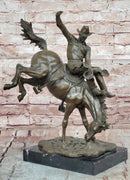 Bronze Sculpture Depicting a Cowboy on a Bucking Horse by Remington Art