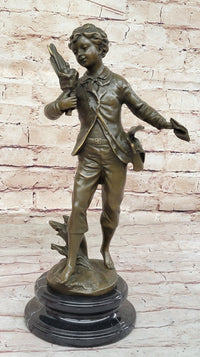 Young School Boy Carrying Supplies - 19th Century Reproduction Sculpture after Bruchon