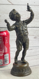 Bronze Sculpture of Child Holding Bird - Signed Milo Art