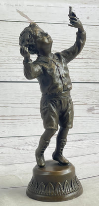 Bronze Sculpture of Child Holding Bird - Signed Milo Art