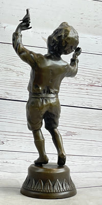 Bronze Sculpture of Child Holding Bird - Signed Milo Art