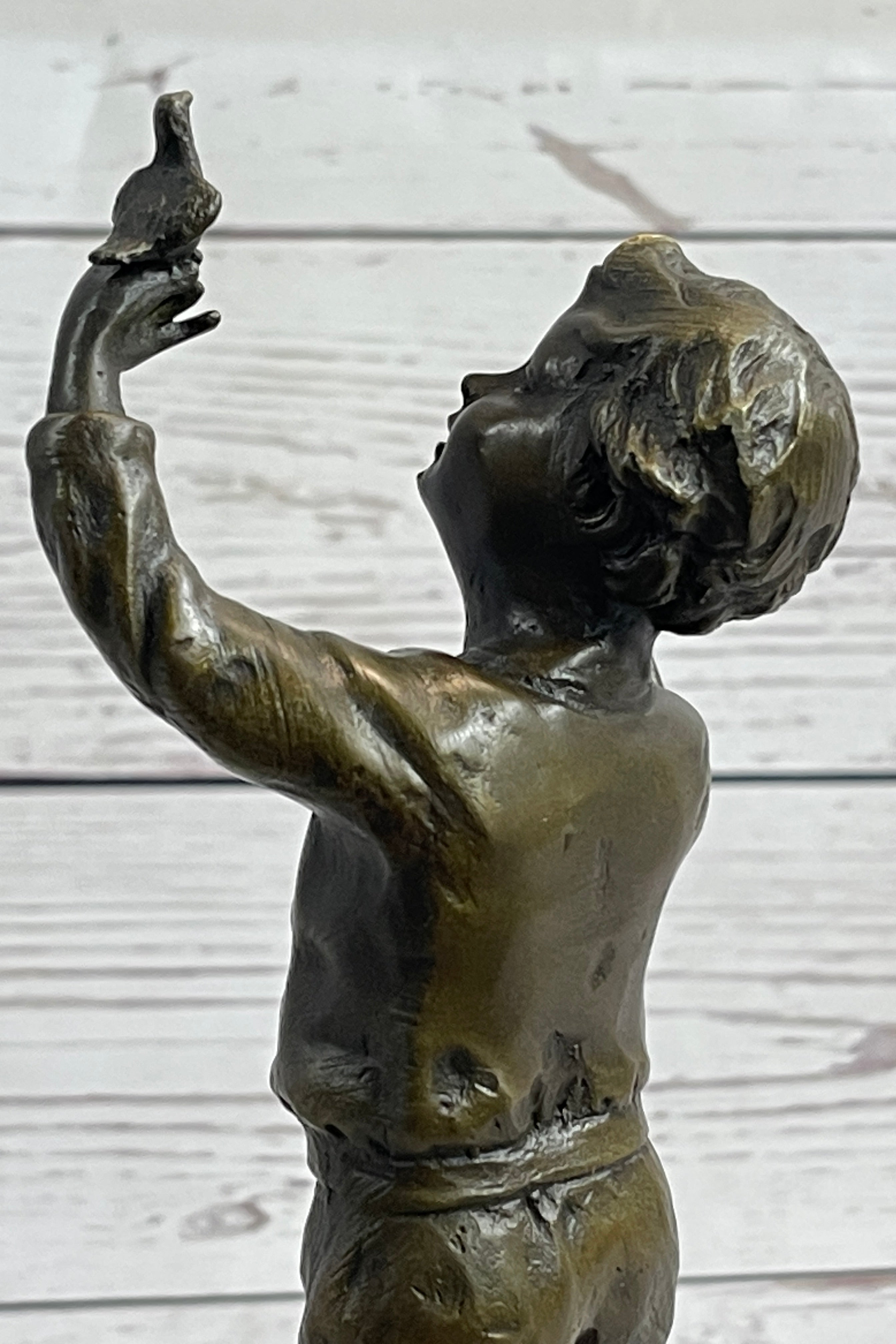 Bronze Sculpture of Child Holding Bird - Signed Milo Art