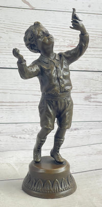 Bronze Sculpture of Child Holding Bird - Signed Milo Art