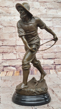 Bronze Fisherman with Net – Nautical Sculpture on Marble