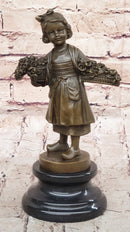Young Girl Carrying Flower Basket - Bronze by Daste