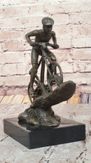 Cyclist on Rocky Terrain Bronze by Mario Nick