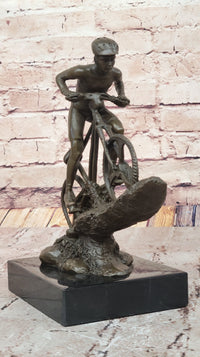 Cyclist on Rocky Terrain Bronze by Mario Nick