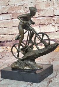 Cyclist on Rocky Terrain Bronze by Mario Nick