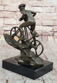 Cyclist on Rocky Terrain Bronze by Mario Nick
