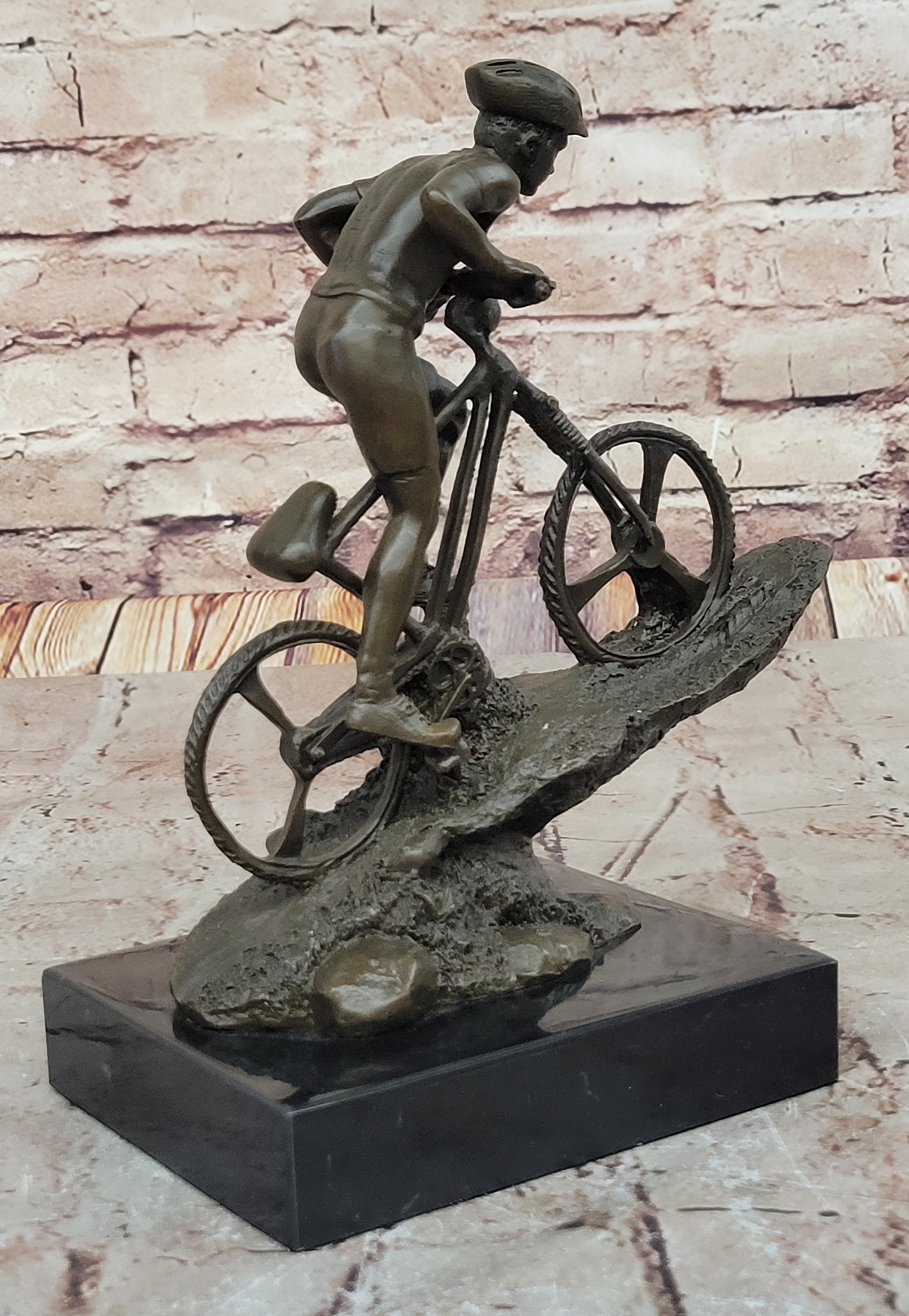 Cyclist on Rocky Terrain Bronze by Mario Nick