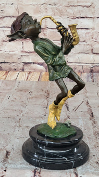 Bronze Elf Leprechaun Playing Golden Saxophone by Juno
