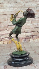 Bronze Elf Leprechaun Playing Golden Saxophone by Juno