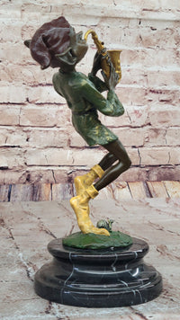 Bronze Elf Leprechaun Playing Golden Saxophone by Juno
