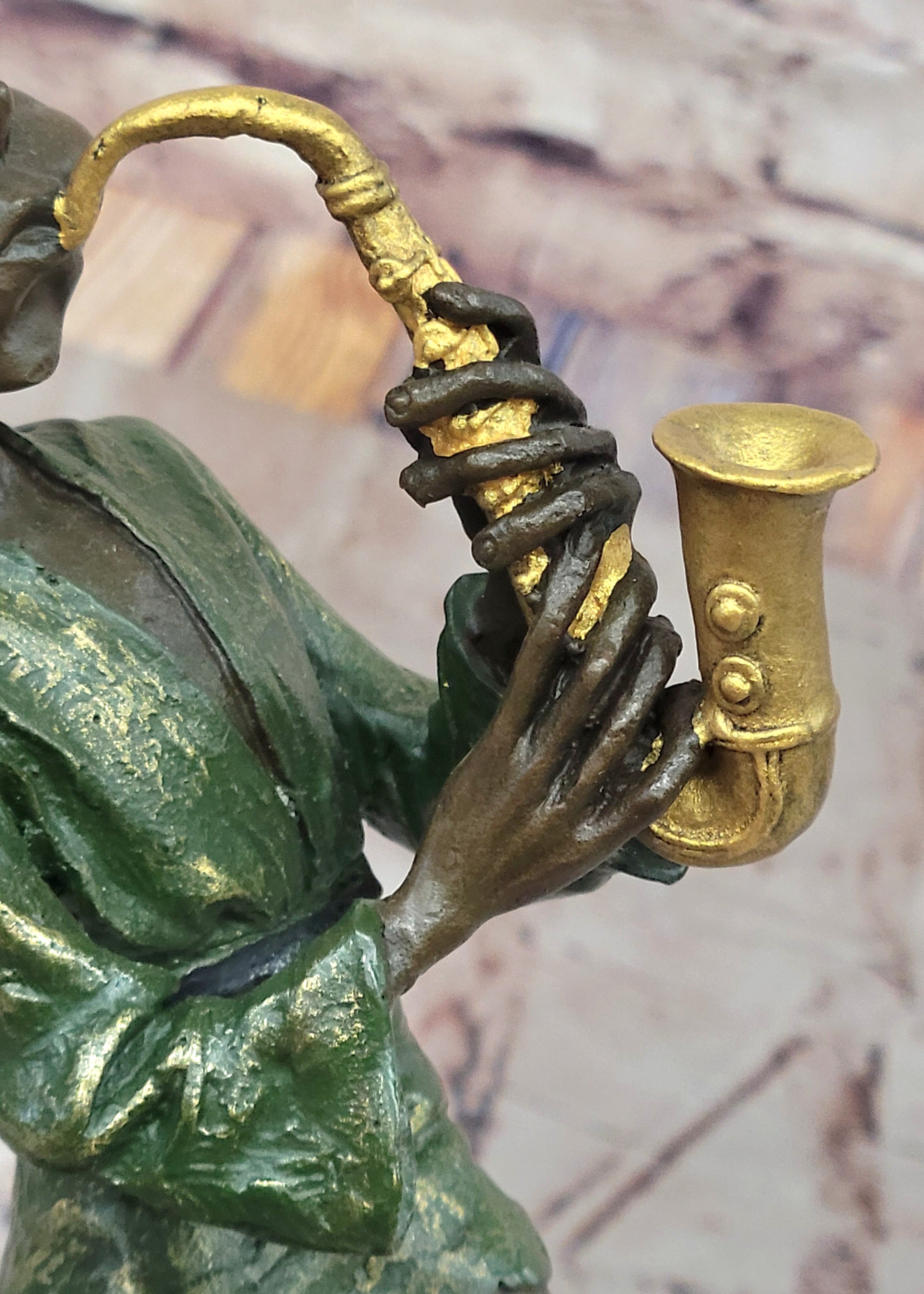 Bronze Elf Leprechaun Playing Golden Saxophone by Juno