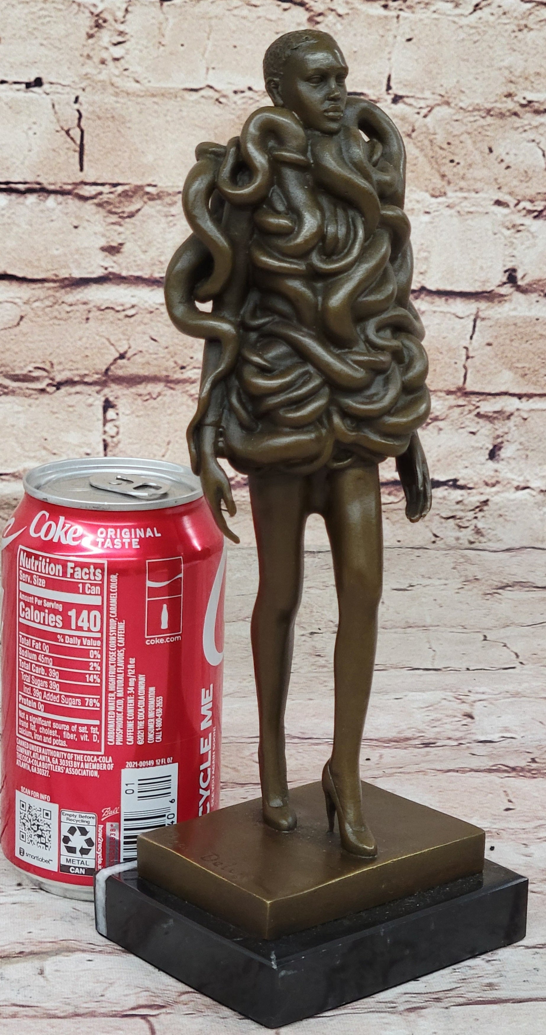 Bronze Sculpture of Woman Wearing Snakes - Unwavering by Pascal Delor