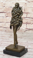 Bronze Sculpture of Woman Wearing Snakes - Unwavering by Pascal Delor