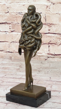 Bronze Sculpture of Woman Wearing Snakes - Unwavering by Pascal Delor