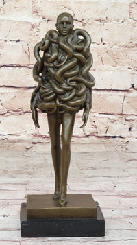 Bronze Sculpture of Woman Wearing Snakes - Unwavering by Pascal Delor