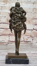 Bronze Sculpture of Woman Wearing Snakes - Unwavering by Pascal Delor