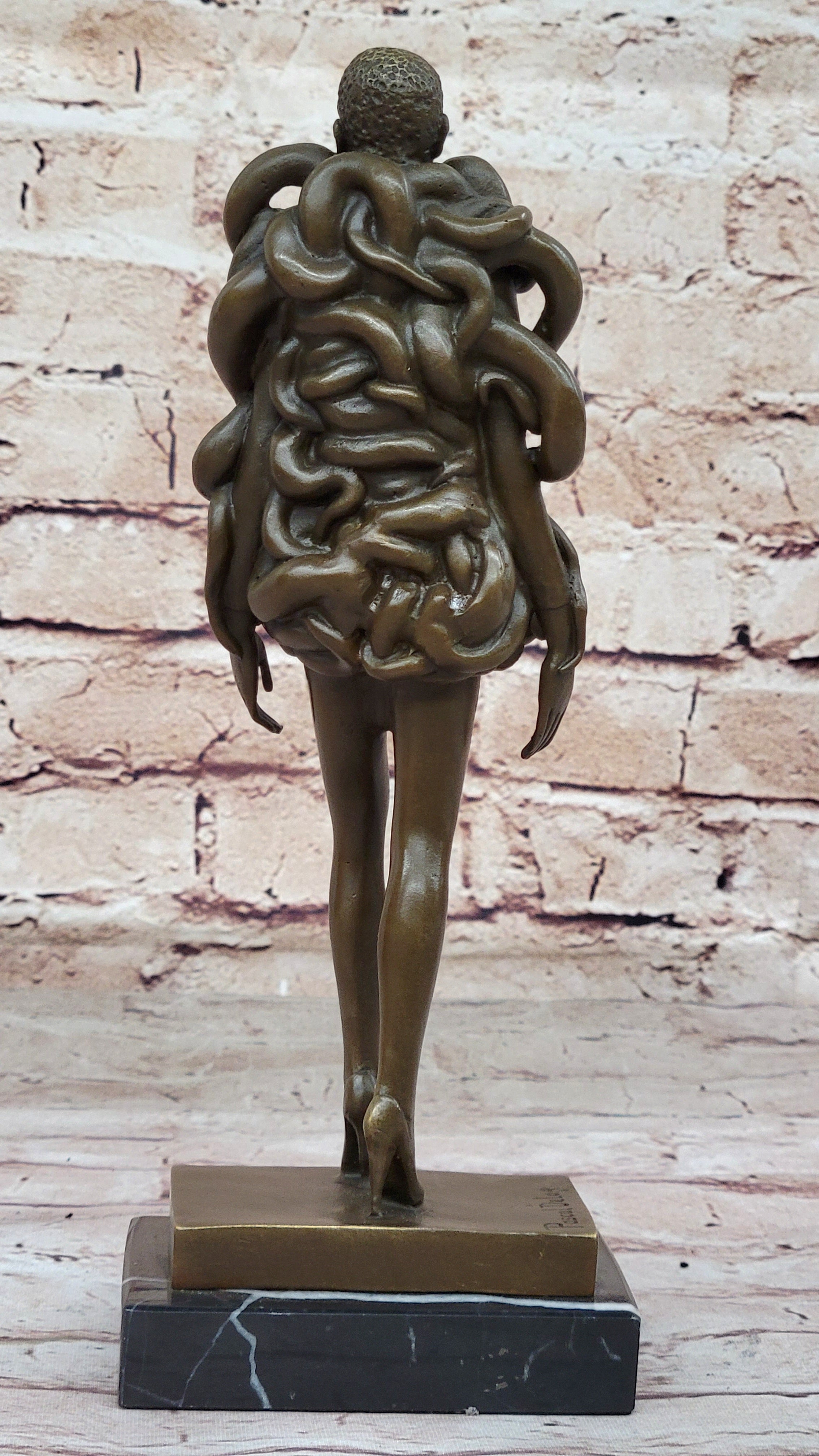 Bronze Sculpture of Woman Wearing Snakes - Unwavering by Pascal Delor
