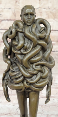 Bronze Sculpture of Woman Wearing Snakes - Unwavering by Pascal Delor