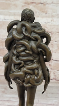 Bronze Sculpture of Woman Wearing Snakes - Unwavering by Pascal Delor